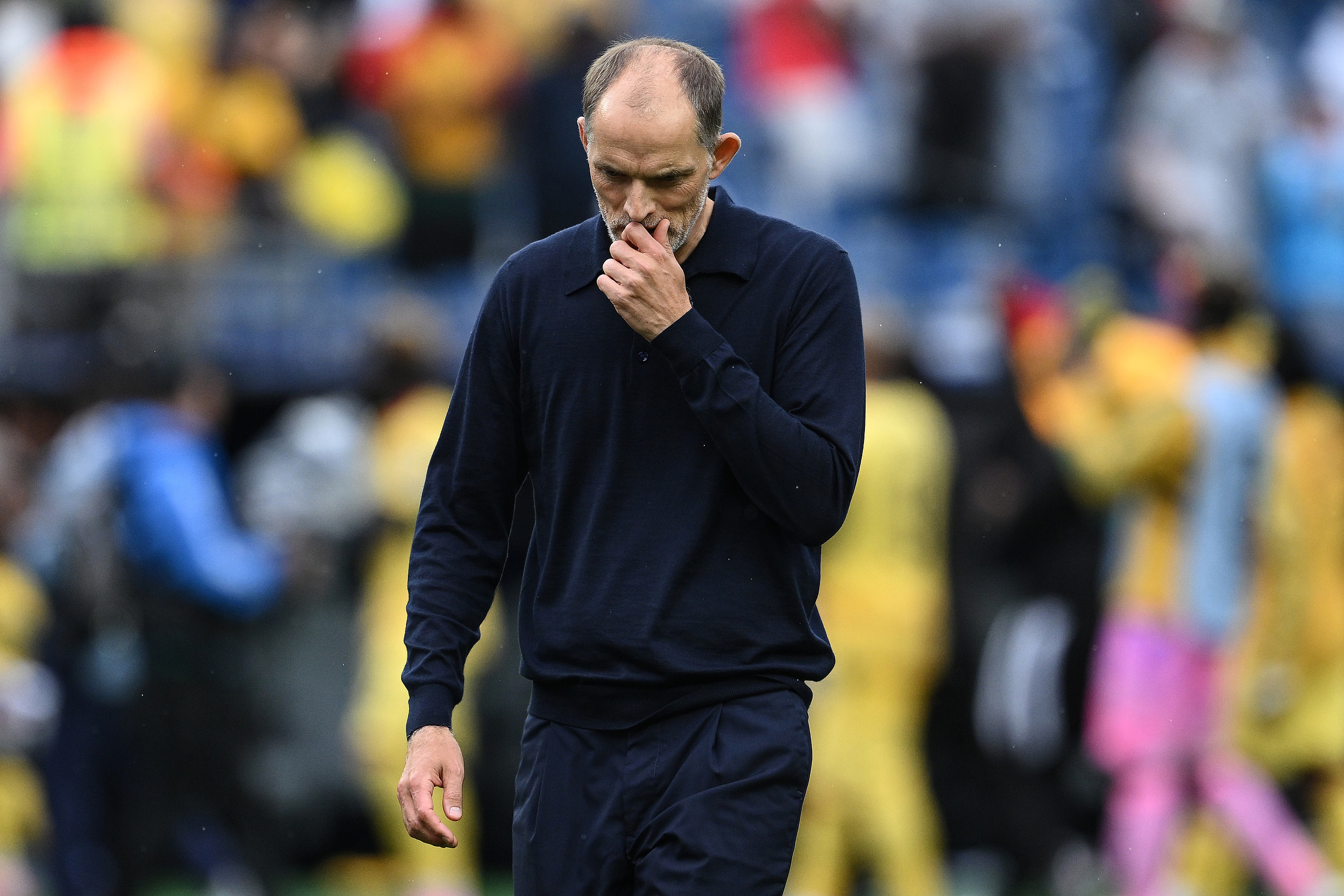 England coach Tuchel ponders with head down.